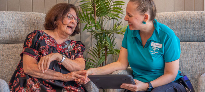 Mercy Place Cairns resident and carer chatting